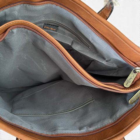 Cotton Road Handbag in brown PU leather with a spacious grey-lined interior and multiple zip compartments