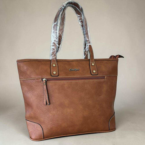 Cotton Road Handbag in warm brown PU leather with twin handles, contrast stitching and front zip pocket