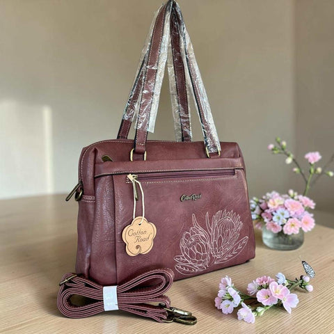 Cotton Road Handbag: PINK PU Leather Handbag with EMBROIDERED PROTEA Design