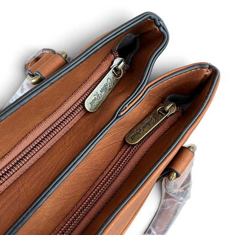 Cotton Road Handbag in brown PU leather, featuring twin zippered compartments and antique-look hardware