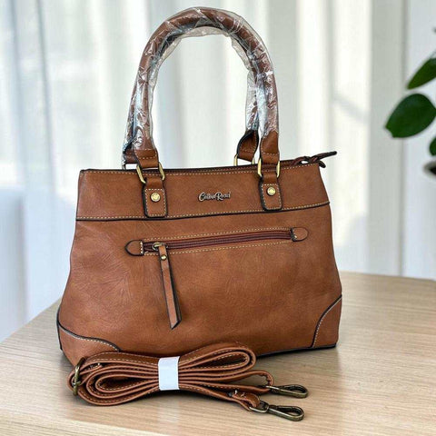 Cotton Road Handbag in warm brown PU leather with twin handles, front zip pocket and detachable shoulder strap