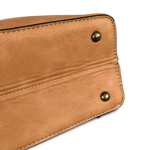 Cotton Road Handbag in tan PU leather with smooth texture, contrast stitching and antique-look metal studs