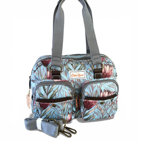 Cotton Road Handbag: TURQUOISE PVC Handbag with PROTEAS