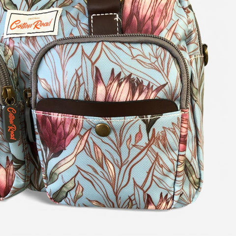 Cotton Road Handbag: TURQUOISE PVC Handbag with PROTEAS