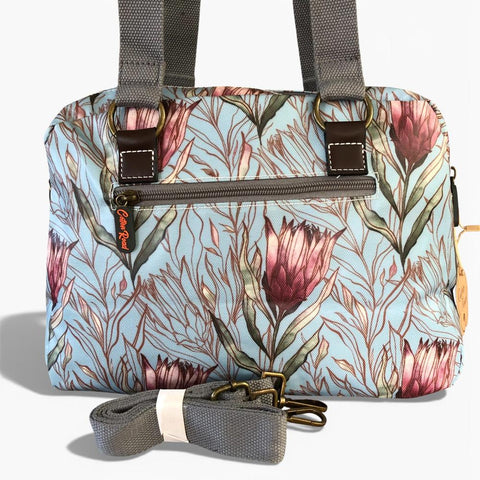 Cotton Road Handbag: TURQUOISE PVC Handbag with PROTEAS