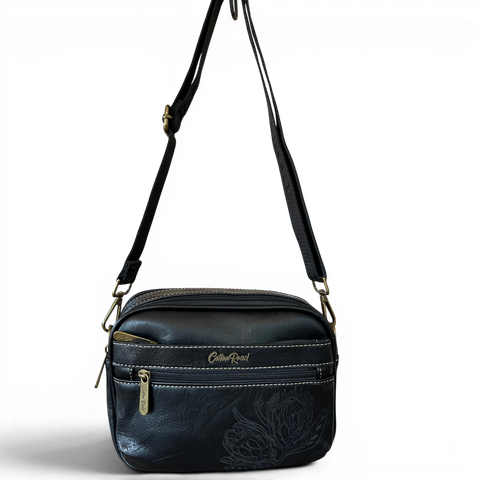 Cotton Road Sling Bag black PU leather crossbody with embroidered Protea and branded strap