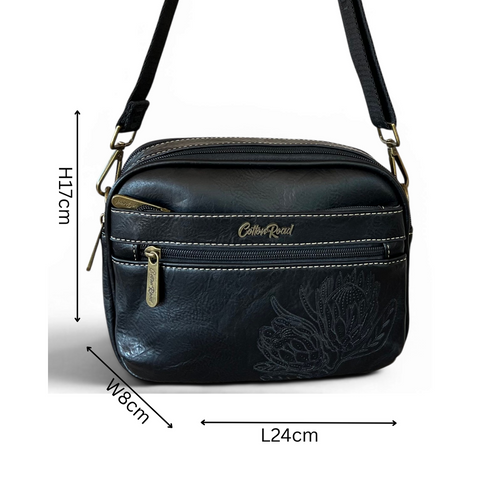 Cotton Road black Protea PU leather sling bag with branded strap and multiple zip compartments