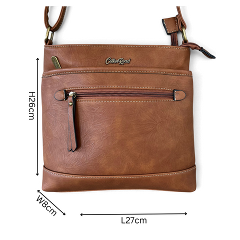 Cotton Road Sling Bag in brown PU leather with contrast stitching, multiple zip pockets and adjustable strap