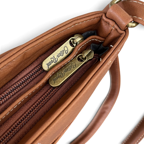 Cotton Road Sling Bag in warm brown PU leather with twin zip compartments and antique-look hardware