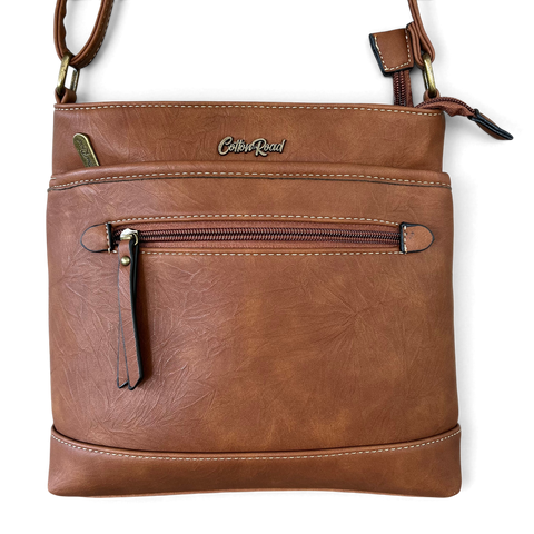 Cotton Road Sling Bag in brown PU leather with contrast stitching, dual zip sections and front zip pocket
