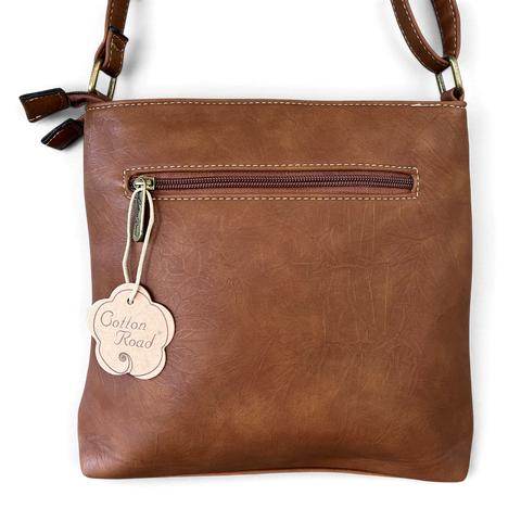 Cotton Road Sling Bag in brown PU leather with contrast stitching, front zip pocket and adjustable strap