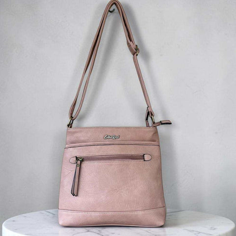 Cotton Road Sling Bag in muted pink PU leather with front zip pocket and adjustable crossbody strap
