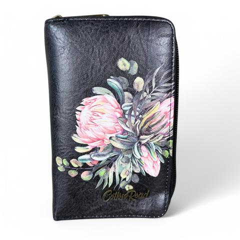 Cotton Road sling bag and matching Protea wallet in black PU leather with floral design