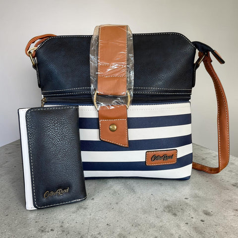 Cotton Road navy blue and white stripe sling bag with matching wallet featuring tan trim and gold hardware