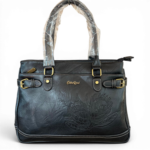 Cotton Road black PU leather handbag with embroidered protea design and antique brass hardware