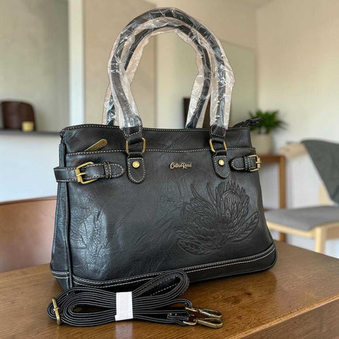 Cotton Road Handbag black PU leather with embroidered Protea design and antique brass hardware
