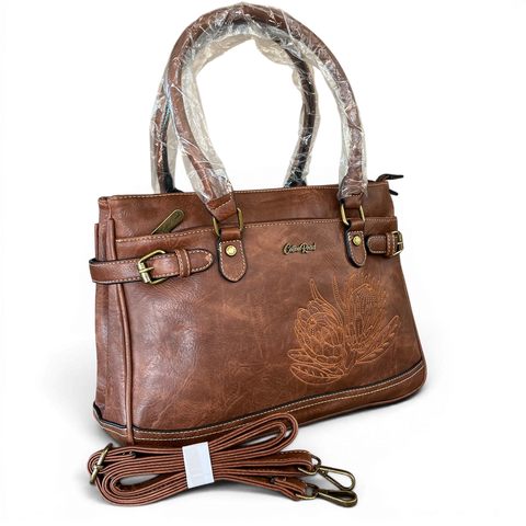 Brown Cotton Road handbag in PU leather with embroidered Protea design and brass hardware