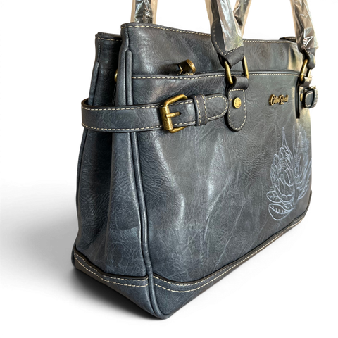 Cotton Road handbag in blue PU leather with embroidered Protea design and antique brass hardware