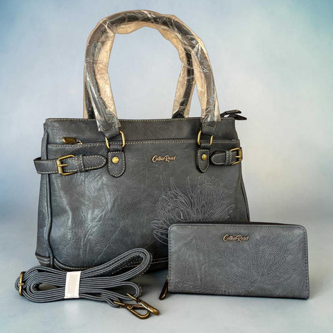 Cotton Road Handbag and matching blue PU leather wallet with embroidered Protea design and antique brass hardware