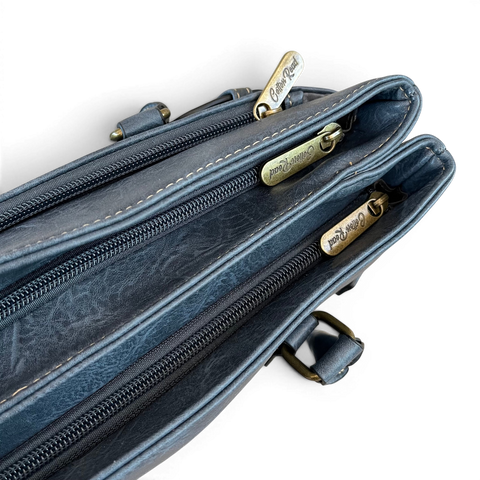 Cotton Road Handbag in blue PU leather with embroidered Protea design and antique brass hardware
