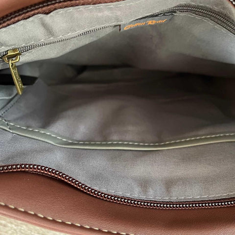 Brown PU leather Cotton Road Sling Bag with multiple zip and magnetic pockets, adjustable strap, and antique brass hardware.