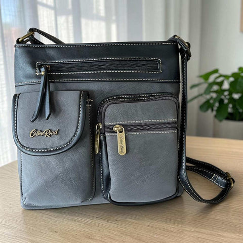 Cotton Road Sling Bag black PU leather crossbody bag with multiple zip pockets and adjustable strap