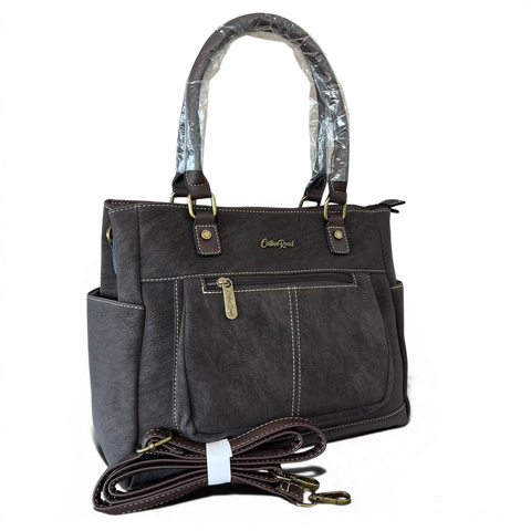 Cotton Road Handbag in khaki PU leather with top stitch and antique brass hardware, featuring multiple zip compartments and adjustable strap.