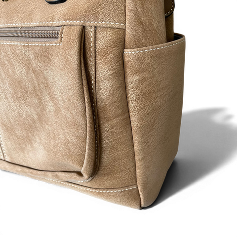 Cotton Road Handbag in khaki PU leather with top stitch and antique brass hardware, featuring multiple zip compartments and adjustable shoulder strap