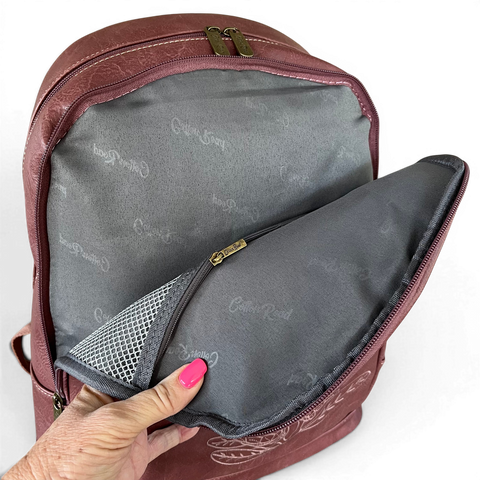 Pink Cotton Road laptop backpack with embroidered Protea design and padded laptop compartment