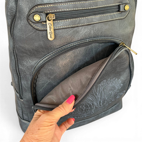 Blue Protea Cotton Road laptop bag in blue PU leather with embroidered design and multiple compartments