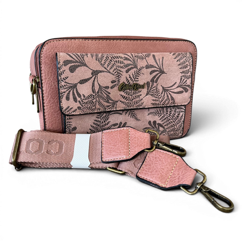 Pink Cotton Road sling bag in PU leather with floral pocket and branded strap