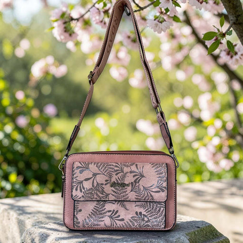 Cotton Road pink PU leather sling bag with floral front pocket and branded shoulder strap
