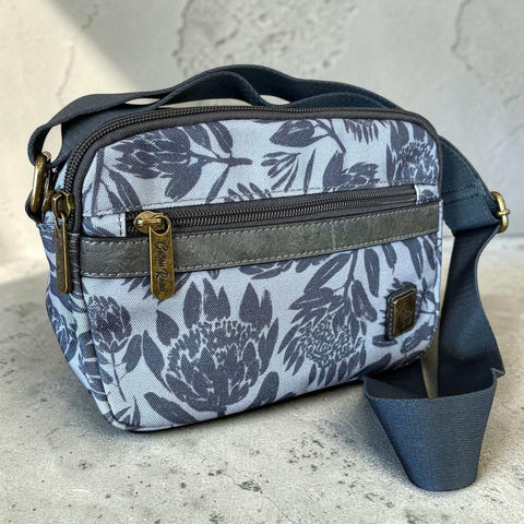 Grey Protea print Cotton Road Sling Bag canvas crossbody with multiple zip pockets and adjustable strap