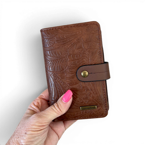Brown PU leather Cotton Road sling bag and matching wallet with embossed botanical design and antique brass hardware