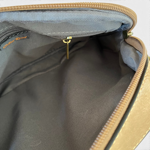 Cotton Road Sling Bag in khaki PU leather with embroidered Protea design and branded adjustable strap