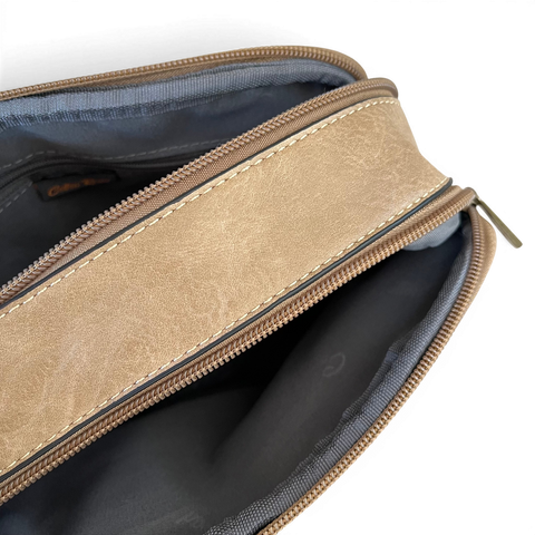 Cotton Road Sling Bag in khaki PU leather with embroidered Protea design and branded adjustable strap