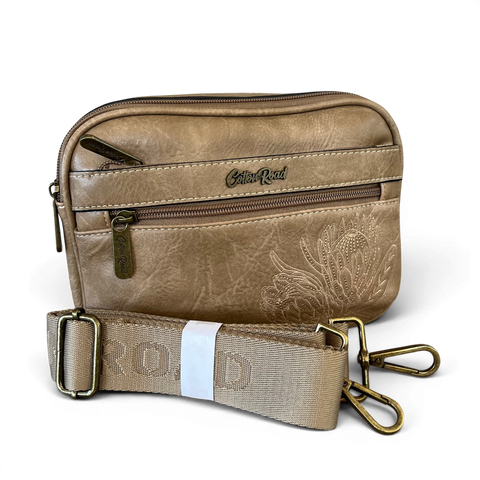 Cotton Road Sling Bag khaki PU leather crossbody with embroidered Protea design and branded strap.