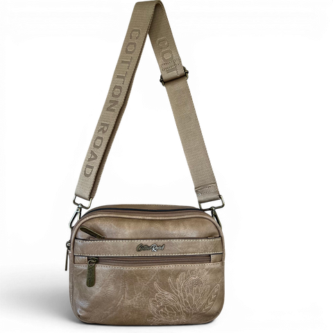 Cotton Road Sling Bag in khaki PU leather with embroidered Protea design and branded strap