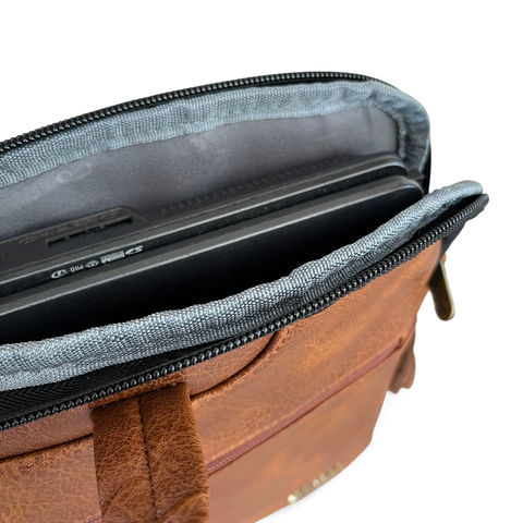 Cotton Road Laptop Bag in brown PU leather with padded laptop compartment and dual zip closures.