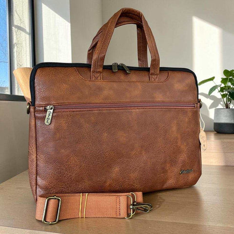 Cotton Road Laptop Bag in brown textured PU leather with padded design, dual handles and adjustable shoulder strap
