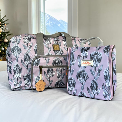 Cotton Road Travel Bag: PURPLE Protea Design PVC Foldaway WEEKENDER with Matching Vanity Bag
