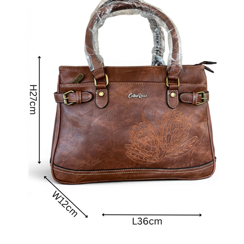 Cotton Road brown PU leather handbag with embroidered protea design and antique brass hardware