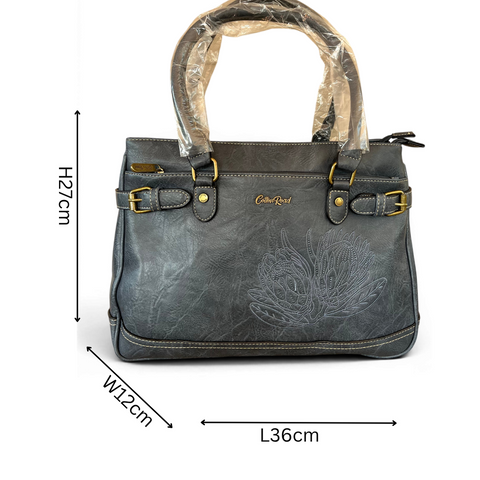 Cotton Road Handbag blue PU leather with embroidered Protea design and antique brass hardware