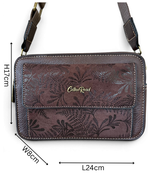 Coffee brown Cotton Road sling bag in PU leather with floral pocket, branded strap, and zip compartments