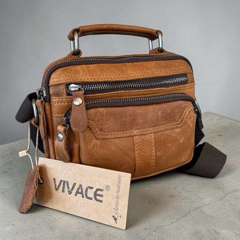 Camel genuine leather sling bag with multiple zip pockets and adjustable strap