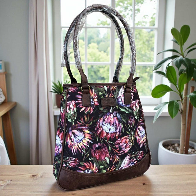 VIVACE Handbag: BLACK Canvas Handbag with BROWN PU Leather Trim and PROTEA design