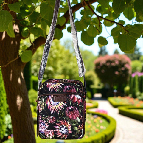 VIVACE Sling Bag: BLACK Canvas Sling Bag with BROWN TRIM and PROTEAS