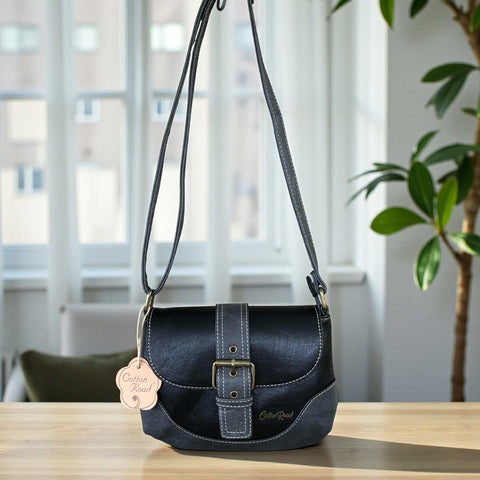 Black PU leather Cotton Road sling bag with buckle clip and adjustable strap